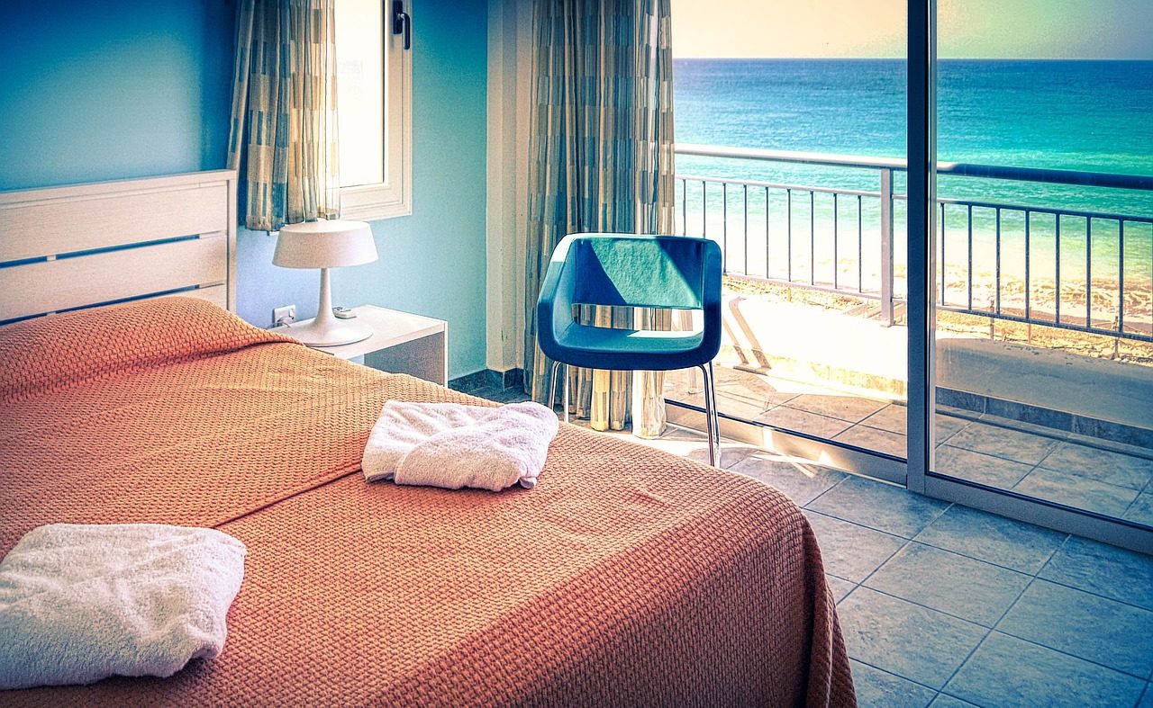 oceanfront room with a ocean view with bed overlooking balcony